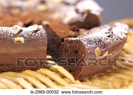 Stock Image - Powdered Sugar on Chocolate Cake. Fotosearch