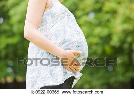 Pregnant Women Holding Her Stomach View Large Photo Image Stock Photography - Pregnant Women Holding Her Stomach. Fotosearch
