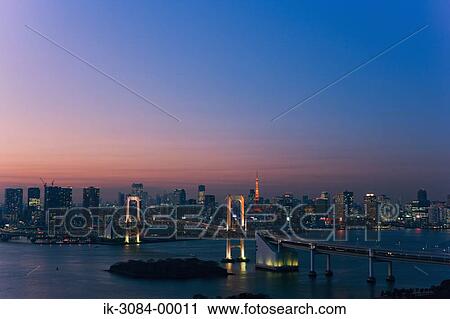 Stock Image - Rainbow bridge with buildings on seaside. Fotosearch