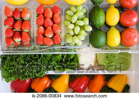 Picture - Refrigerator Filled with Fruits and Vegetables. Fotosearch