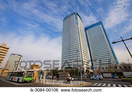 Stock Photograph - Road with buildings in downtown. Fotosearch