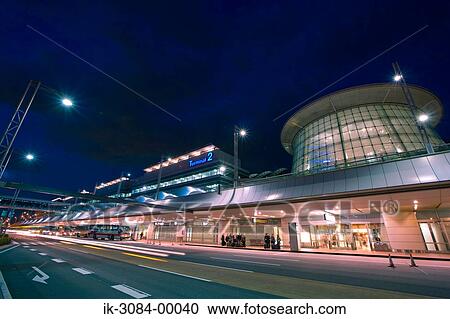Roads with illuminated lights at airport terminal View Large Photo Image Stock Image - Roads with illuminated lights at airport terminal. Fotosearch