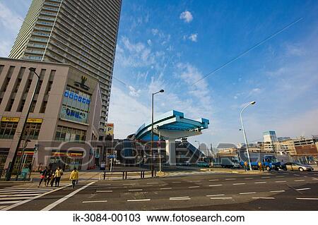 Roadside buildings in downtown against blue sky View Large Photo Image Stock Image - Roadside buildings in downtown against blue sky. Fotosearch