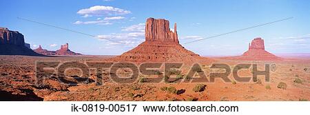 Rugged Cliffs against Cloudy Sky View Large Photo Image Stock Photo - Rugged Cliffs against Cloudy Sky . Fotosearch