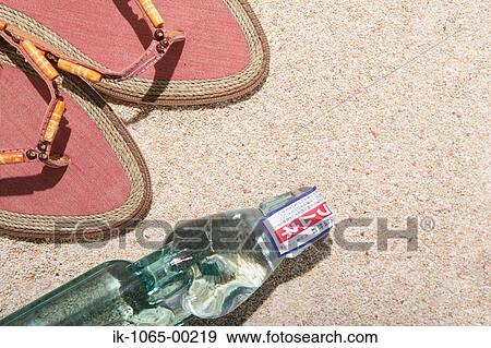 Stock Photo - Sandals and Bottle of Ramune. Fotosearch