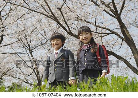 Schoolmate going to school and looking at camera View Large Photo Image Picture - Schoolmate going to school and looking at camera. Fotosearch