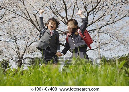 Schoolmate going to school and looking at camera View Large Photo Image Stock Photo - Schoolmate going to school and looking at camera. Fotosearch