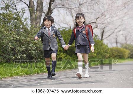 Schoolmate going to school and looking at camera View Large Photo Image Stock Photography - Schoolmate going to school and looking at camera. Fotosearch