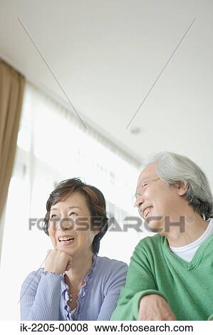 Stock Photo - Senior Asian couple smiling together. Fotosearch