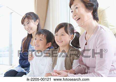 Stock Image - Sibling with mother and grandma. Fotosearch