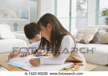 Siblings Drawing and Having Fun View Large Photo Image Stock Photograph - Siblings Drawing and Having Fun. Fotosearch