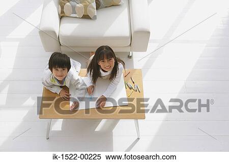 Stock Photography - Siblings Drawing and Having Fun. Fotosearch