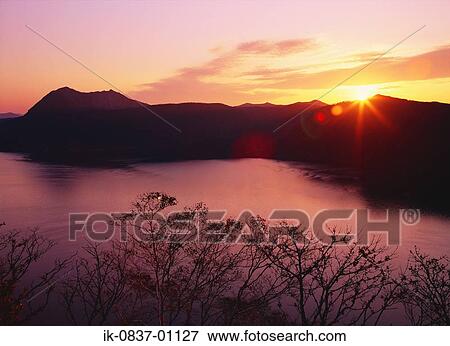 Silhouette of mountains at sunset View Large Photo Image Stock Photo - Silhouette of mountains at sunset. Fotosearch