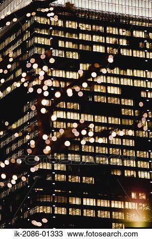 Stock Image - Skyscrapers at Night. Fotosearch