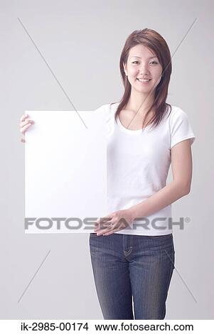 Picture - Smiling Japanese Woman with Whiteboard. Fotosearch