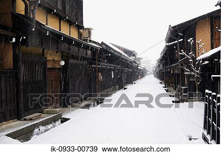 Snow Covered Road and Building in Snowfall View Large Photo Image Stock Photo - Snow Covered Road and Building in Snowfall. Fotosearch