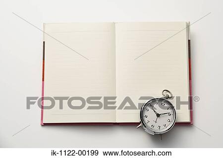 Stock Photo - Still life of laptop, spectacles, pen and diary. Fotosearch