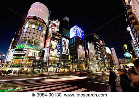Street with shopping malls on roadside View Large Photo Image Stock Image - Street with shopping malls on roadside. Fotosearch