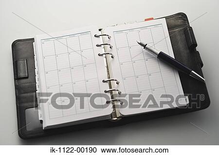 Studio shot of an open notebook View Large Photo Image Stock Image - Studio shot of an open notebook. Fotosearch