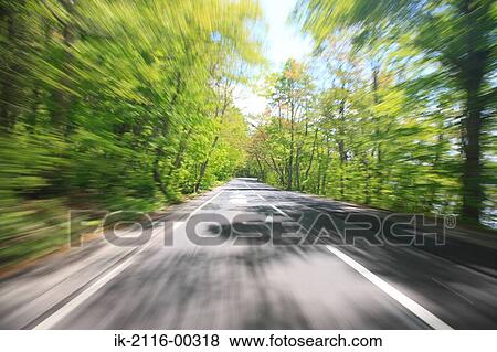 Sunbeams Shining Through Branches of Tree in Empty Road View Large Photo Image Stock Photo - Sunbeams Shining Through Branches of Tree in Empty Road. Fotosearch
