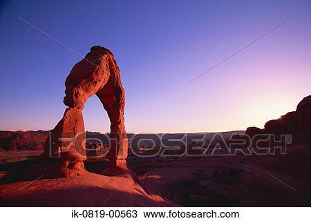 Stock Image - Sunshine Through Rock Formation. Fotosearch
