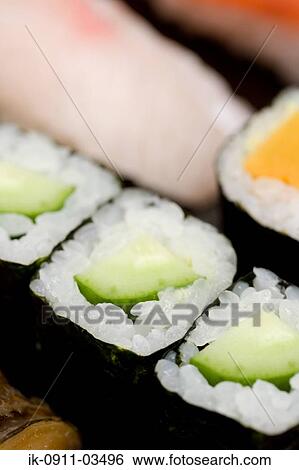 Sushi Rolls Garnished with Cucumber View Large Photo Image Stock Photograph - Sushi Rolls Garnished with Cucumber. Fotosearch