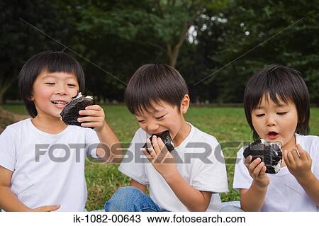 Three boys eating chocolate cake View Large Photo Image Stock Image - Three boys eating chocolate cake. Fotosearch