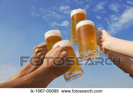 Stock Photography - Toasting of Beer. Fotosearch