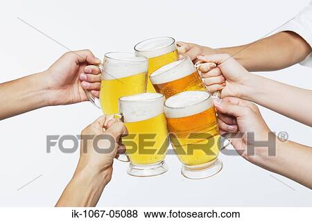 Stock Photo - Toasting with Beer. Fotosearch