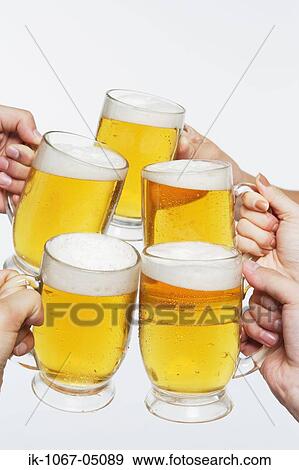 Toasting with Beer View Large Photo Image Stock Photo - Toasting with Beer. Fotosearch