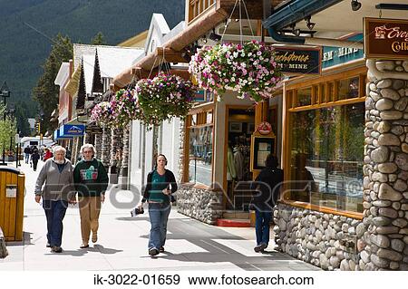 Tourist Walking on Street in Banff, Alberta, Canada View Large Photo Image Stock Photo - Tourist Walking on Street in Banff, Alberta, Canada. Fotosearch