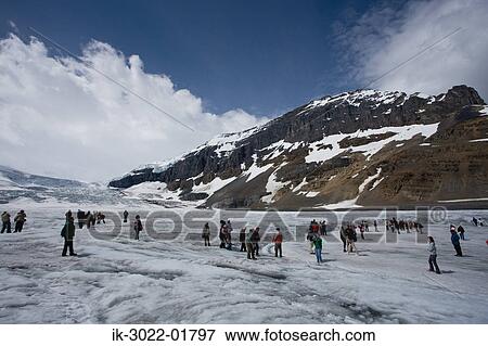 Stock Photo - Tourists at Columbia Ice Field in Canada. Fotosearch