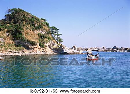 Stock Image - Tourists at Niemon Island, Japan. Fotosearch