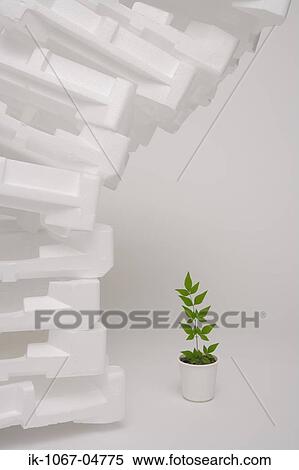 Stock Photography - Tower of Foam next to Plant. Fotosearch
