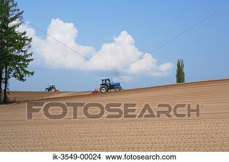 Tractors tilling farm field View Large Photo Image Picture - Tractors tilling farm field. Fotosearch