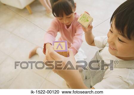 Two Children Playing with Building Blocks View Large Photo Image Stock Image - Two Children Playing with Building Blocks. Fotosearch