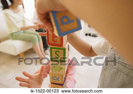 Two Children Playing with Building Blocks View Large Photo Image Stock Image - Two Children Playing with Building Blocks. Fotosearch