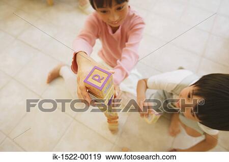 Stock Photo - Two Children Playing with Building Blocks. Fotosearch
