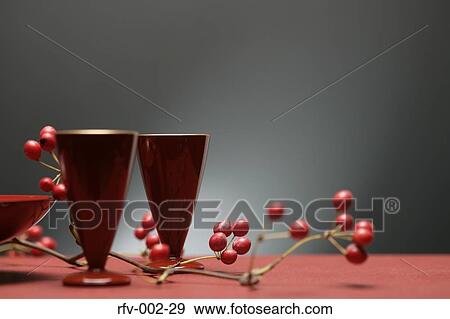 Stock Photo - Two Cups with Cherry Twigs. Fotosearch