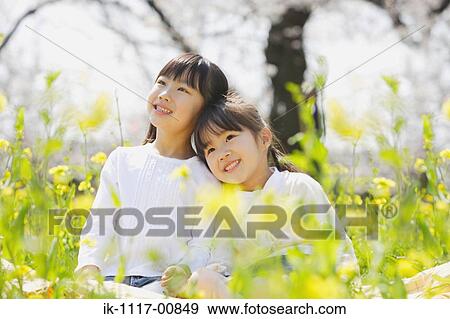 Two cute Japanese girls enjoying together View Large Photo Image Stock Photo - Two cute Japanese girls enjoying together. Fotosearch