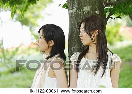Two young sad women View Large Photo Image Stock Image - Two young sad women. Fotosearch
