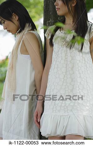 Two young sad women View Large Photo Image Stock Image - Two young sad women. Fotosearch