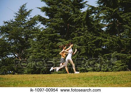 Picture - Two Young Women Jogging. Fotosearch