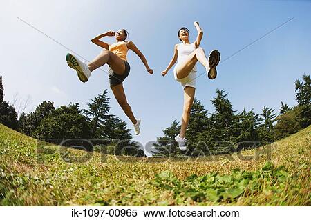 Two Young Women Jogging View Large Photo Image Stock Photography - Two Young Women Jogging. Fotosearch