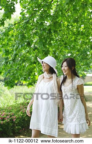 Stock Image - Two young women smiling. Fotosearch