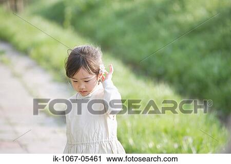 Unhappy girl standing outdoors View Large Photo Image Stock Image - Unhappy girl standing outdoors. Fotosearch