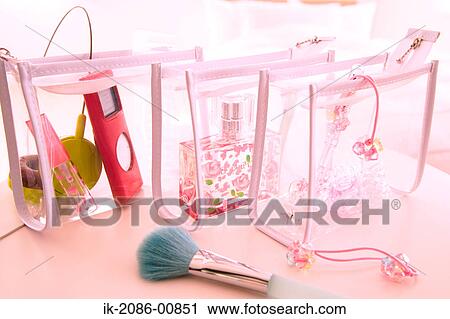 Stock Image - Vanity Bag with Alarm Clock and Brush. Fotosearch