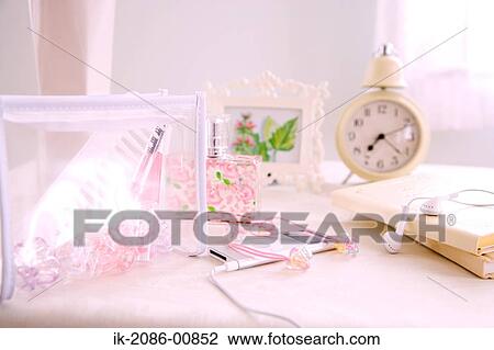Stock Image - Vanity Bag with Alarm Clock and Ipod. Fotosearch