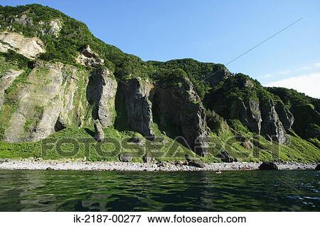 Stock Photo - View of Ripples with Pebbles. Fotosearch