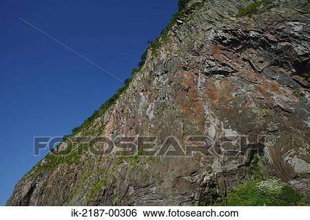 Stock Photograph - View of Rugged Cliff . Fotosearch